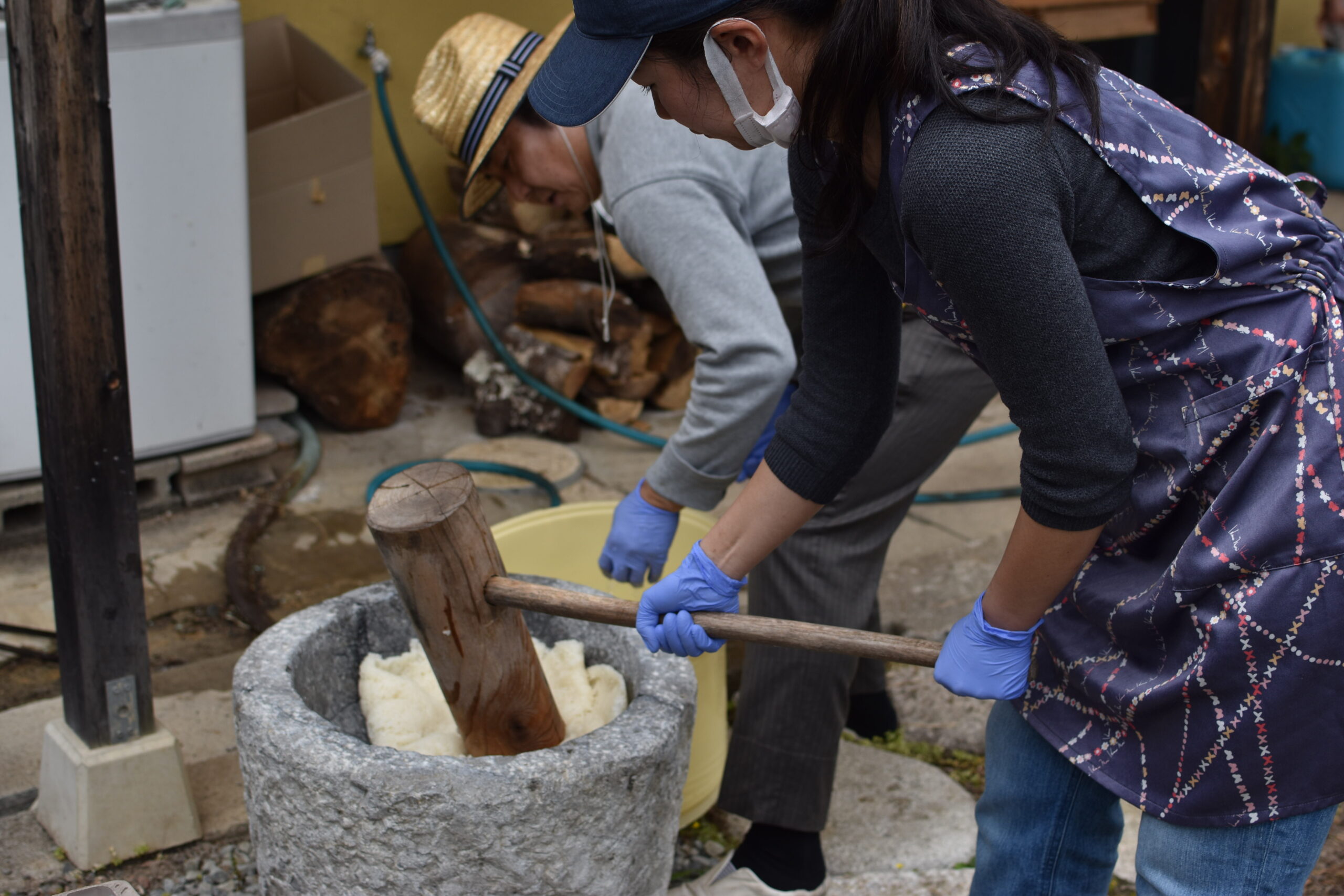Guests taking part in a traditional mochi pounding session in Kyoto