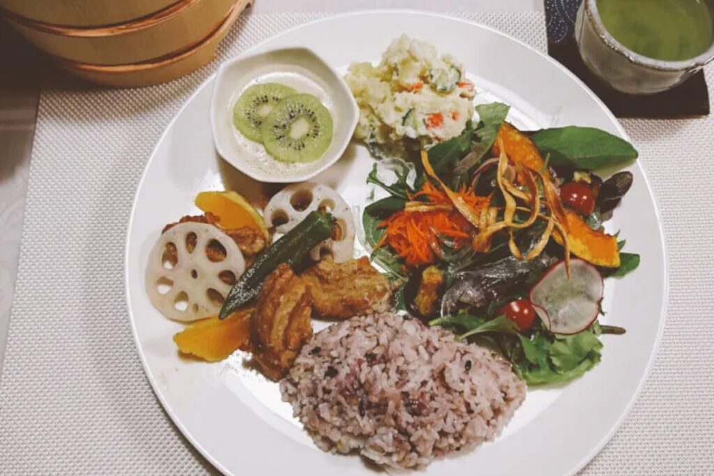 Colorful plant-based Japanese meal plate from a Tokyo vegan cooking class with fifteen-grain rice