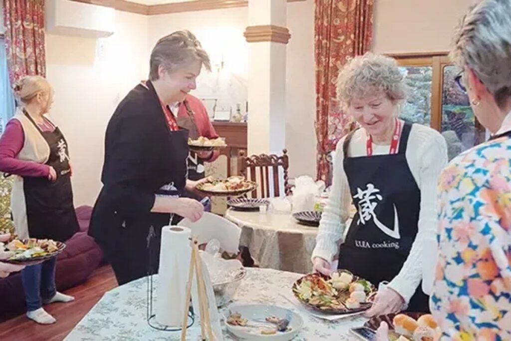 Guests plating their finished Japanese home-cooked dishes together during a Nagoya cooking class