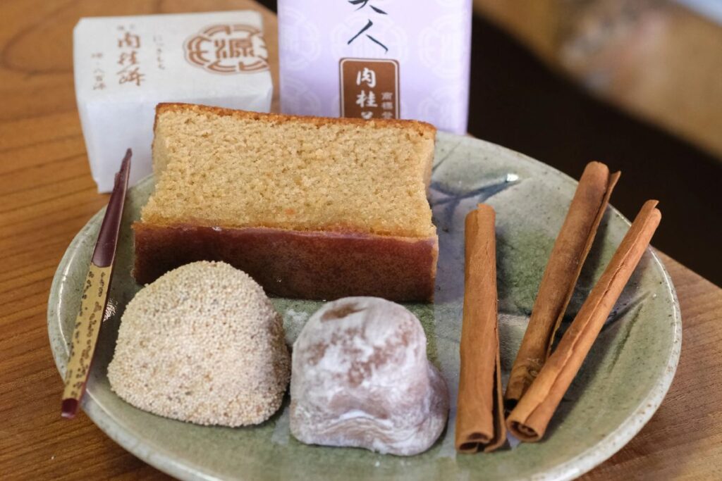 A small plate featuring traditional Japanese sweets and cinnamon sticks served before exploring the city.