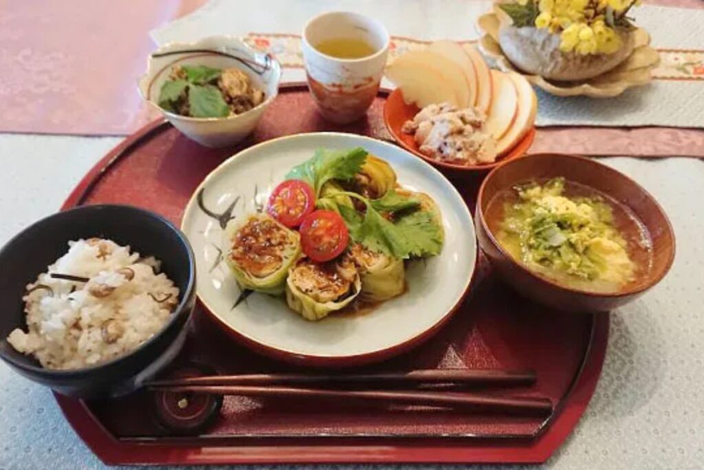 Wholesome seasonal Japanese meal with stuffed cabbage rolls and mixed rice from a Nagoya cooking class