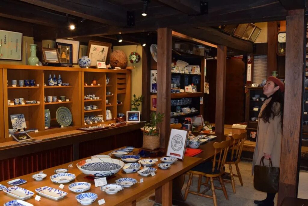 Authentic regional pottery and ceramic dishes elegantly displayed inside a long-established family business store.