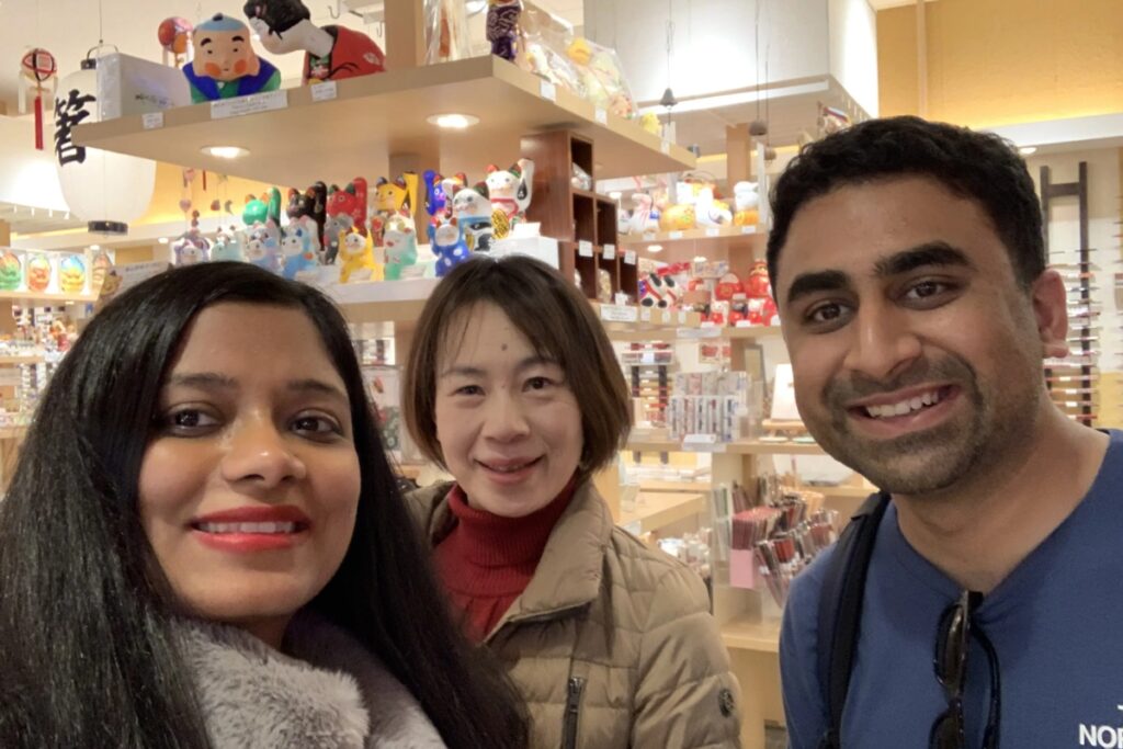 Travelers with their guide at a traditional craft shop during a private full-day Tokyo tour