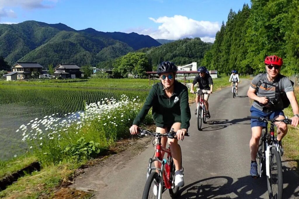 A guest enjoying the scenic mountain views on the Hida Furukawa Bike Tour.