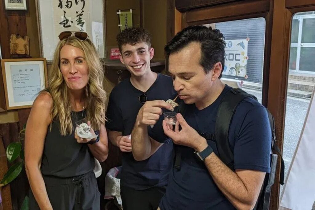 Travelers enjoying traditional sweet treats together.