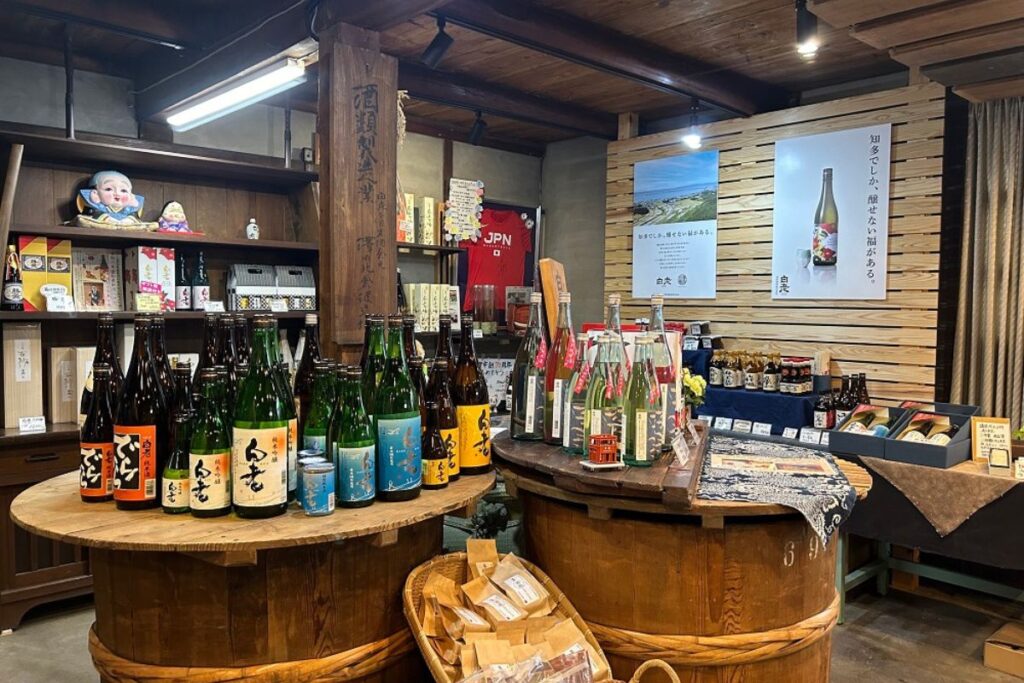 The traditional retail shop and sake display inside the historic venue hosting the sake label making experience.